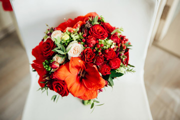 Beautiful wedding bouquet at white chair.
