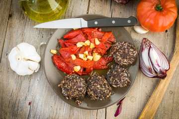 fried peppers and sausage served on wooden