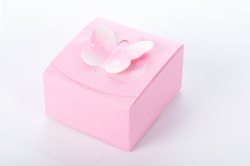 Pink gift box on white background with soft shadow