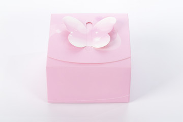 Pink gift box on white background with soft shadow