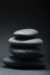 Stack of grey stones over grey background