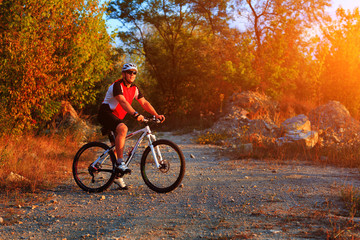 Active man on bike with nature background