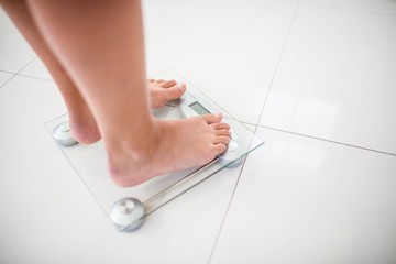 Feet of woman on weighting scale