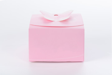 Pink gift box on white background with soft shadow