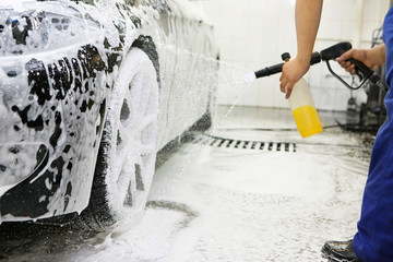 Close up detail of wash cleaning brush on car at carwash - 103512280