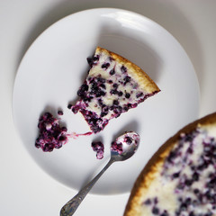 piece of homemade bluberry pie with cream 
