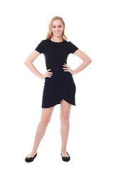Full length portrait of an attractive professional woman wearing black dress suite and heels, isolated on a white background.