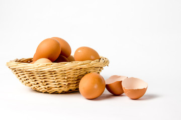 Eggs with broken shells on white background.