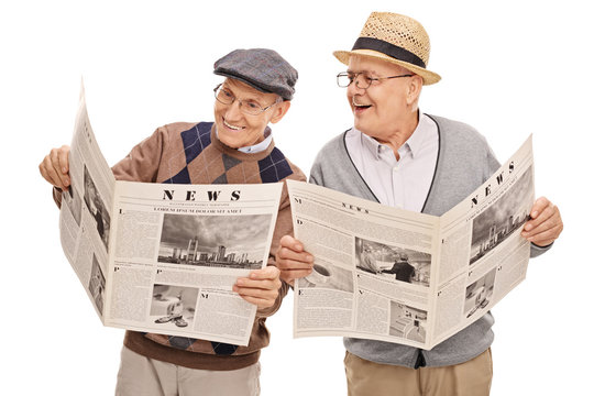 Two seniors reading the news together
