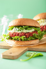 veggie beet and quinoa burger with avocado dressing