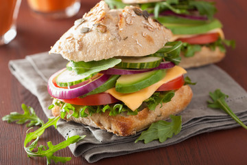 tomato avocado cheese sandwich with cucumber onion