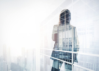 Photo of businesswoman. Double exposure, city on the background. Blurred background, horizontal
