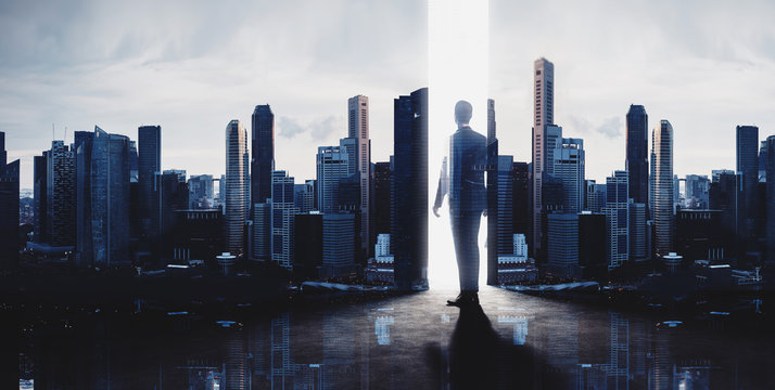 Concept of businessman and skyscrapers. Modern city background. Double exposure, wide