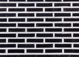 Black and white brick wall to use as a background pattern or texture.