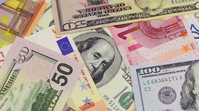 Dollars and Euro Banknotes Rotate