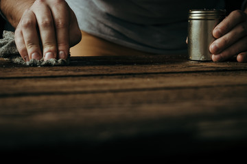 POV male hands on wooden desk