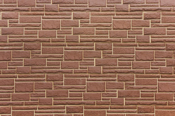 Texture of brown stone wall background