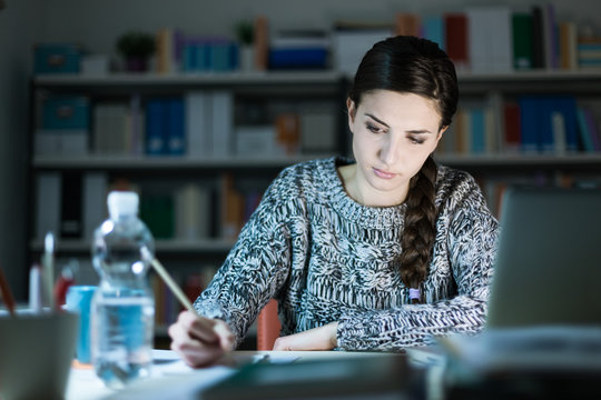 Young woman doing homework