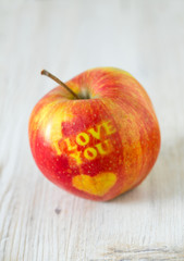 apple with heart and text 'i love you'