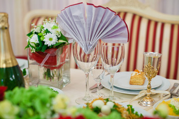 stylish luxury golden decorated table with red for the celebrati