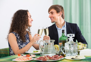 Couple having romantic dinner in home .