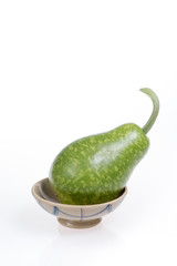 bottle gourd on a bowl