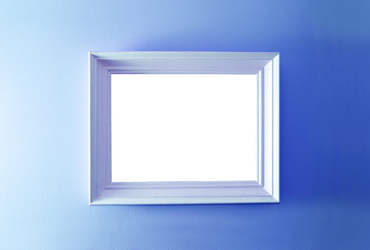 Empty frame on the blue wall.