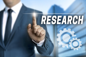 research touchscreen is operated by businessman