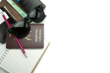 Sunglass,passport,notebook and pencil on white background, concept for Traveler background.