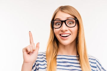 Close up photo of girl in glasses  having an idea