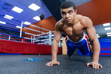 Fototapeta premium Boxer doing push ups
