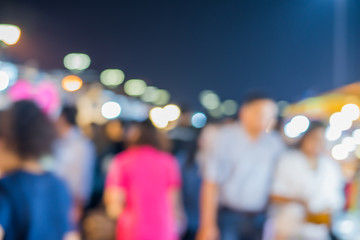 blur background of Crowd at night market 