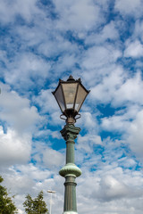 Fototapeta na wymiar Old-fashioned street lamp against the sky. Belfast, Northern Ireland