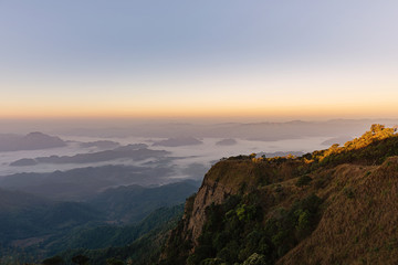 Fototapeta na wymiar mountain ridge with mist in morning, Beautiful mountain ridge for hiking at Doi Tu Lay (Mon Tu Lay) , Tak province Thailand