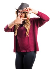 Hipster young girl focusing with her fingers