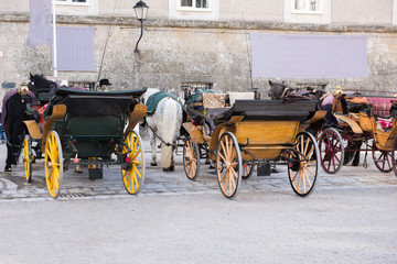 historic coaches in the historic oldtown of salzburg