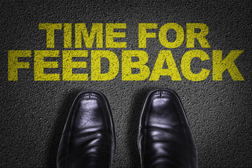 Top View of Business Shoes on the floor with the text: Time for Feedback