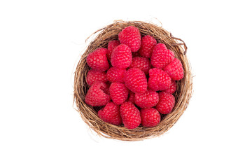 Raspberries in a basket on white background