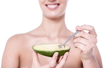 Cropped picture of woman with avocado