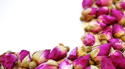 Border frame of romantic dried pink rose buds