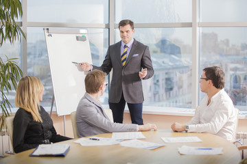 businessman conducting a presentation at the Board