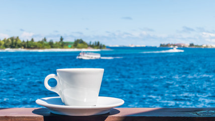 Coffee cup with beautiful seascape background
