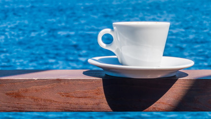 Coffee cup with beautiful seascape background