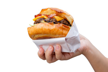 hand holding tasty hamburger isolated on  white background.
