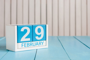 February 29th. Cube calendar for february 29 on wooden surface with empty space For text. Leap year, intercalary day - obrazy, fototapety, plakaty