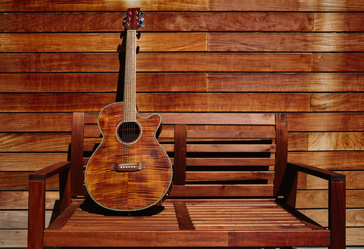 acoustic brown guitar in wooden stripes