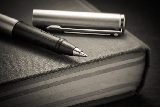 pen and book with filter effect retro vintage style