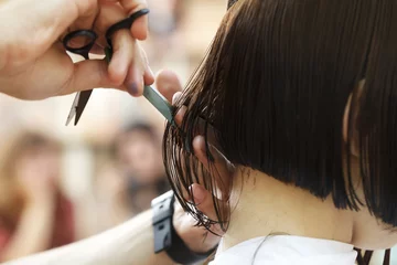 Foto op Plexiglas stylist hairdresser doing haircut © homonstock