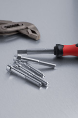 Spanner tool and screws