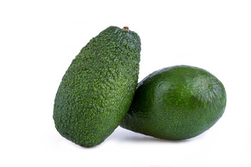 Two avocados isolated on a white background.